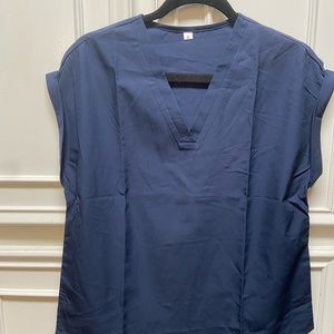 Navy Blue short sleeves that are cuffed V neck top. Necklace not included.